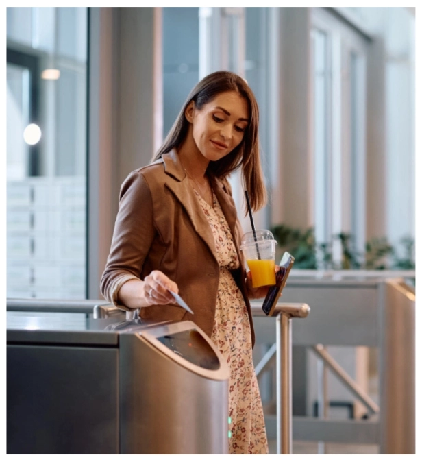 lady-using-RFID-card-to-unlock-the-automatic-turnstile